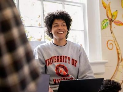 Student in grey sweatshirt